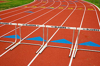 View of Lancaster Mennonite REGUPOL champion AG track with hurdles.