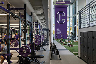 View of the Cornell College, lower level athletic performance facility and the seamless transition with the turf area. The facility utilized REGUPOL aktiv flooring to provide a durable surface for athletes.