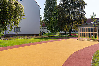 Accessible REGUPOL Play and Recreation Area in Berlin-Steglitz-Zehlendorf Accessible play and recreation area in Berlin-Steglitz-Zehlendorf featuring REGUPOL playfix fun impact-absorbing safety surfacing and REGUPOL multicourt DLX sports surfacing.