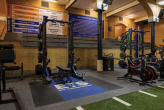 A variety of equipment and machines reside within the Elite Training Systems facility. There are also quotes found on the walls to motivate athletes throughout their workouts. REGUPOL inlaid platforms provide increased durability during heavy-weight training. 