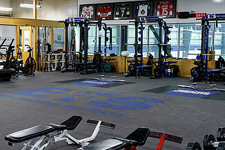 Angled view of the Elite Training Systems facility located at Iroquois Park Sports Centre. The weight training facility offers a variety of equipment and machines for athletes to utilize, from benches and weight racks to plyometrics.