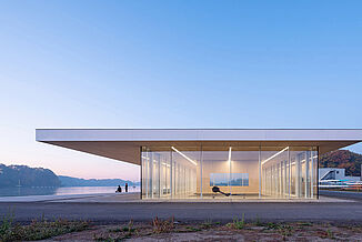 Front view of the Neil Campbell Rowing Centre, the innovative rowing facility that features REGUPOL aktivpro tile flooring. The facility was constructed directly beside the water.