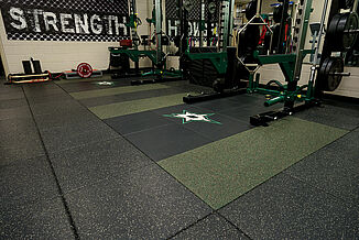 Dallas Stars weight training facility features a variety of equipment and weights for their athletes to utilize. REGUPOL aktivpro tiles are used throughout the facility. 