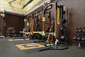 Alternative view of the weight room for the Hershey Bears featuring a variety of equipment and tools for athletes, all placed on REGUPOL aktivpro roll flooring.