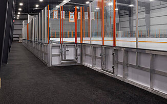 View of Thayer Sports Center's indoor ice hockey rink featuring REGUPOL sports flooring.