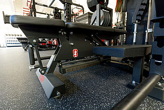 A close look at the weight training benches and REGUPOL aktivpro roll flooring at Stanford University's athletic performance center.