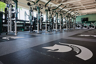 Close-up of REGUPOL flooring with the Michigan State Spartan logo.