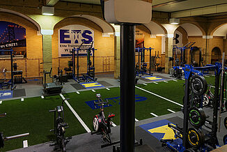 Aerial view of the Elite Training Systems facility in the Honourable W.C. Kennedy Collegiate building. The facility features a turf area and REGUPOL aktivpro roll flooring and REGUPOL crash inlaid platforms for optimal durability and versatility. 