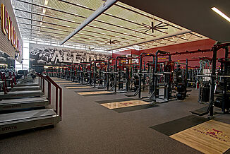 Athletic performance facility at Iowa State University, featuring rows of weight racks and individualized platforms for each. REGUPOL aktivpro roll flooring provides a seamless floor option.