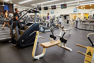 View of the New York Fitness Club facility featuring cardio equipment and weight training options. All equipment throughout the facility rests on REGUPOL aktiv rolled rubber flooring.