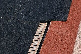 A view of the transitional space between REGUPOL abzorb and the track surface at Spring Grove Area High School.