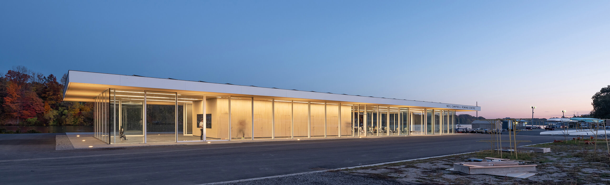 View of the Neil Campbell Rowing Centre facility, features full glass walls, demonstrating the innovative design of the facility. 